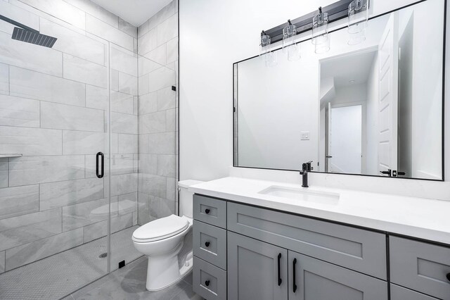 1707 Milby St, Houston, TX 77003 - bathroom with a stall shower, toilet, vanity, and marble finish flooring