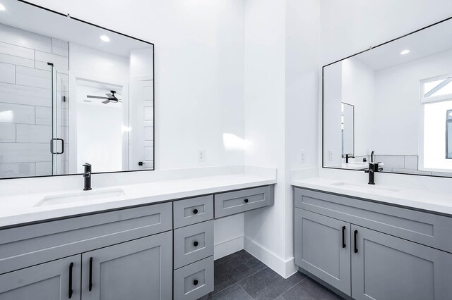 1707 Milby St, Houston, TX 77003 - bathroom with vanity, a stall shower, tile patterned flooring, recessed lighting, and baseboards