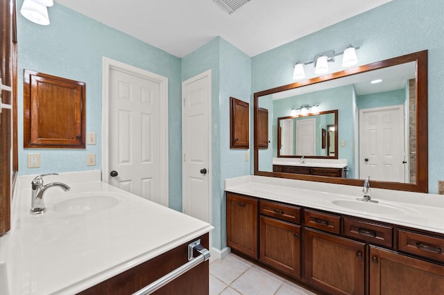6119 Plantation Bay Dr, Katy, TX 77449 - full bath featuring two vanities and tile patterned flooring