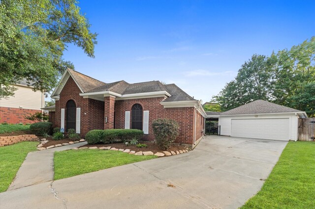 6119 Plantation Bay Dr, Katy, TX 77449 - traditional-style home featuring brick siding, a garage, and a shingled roof