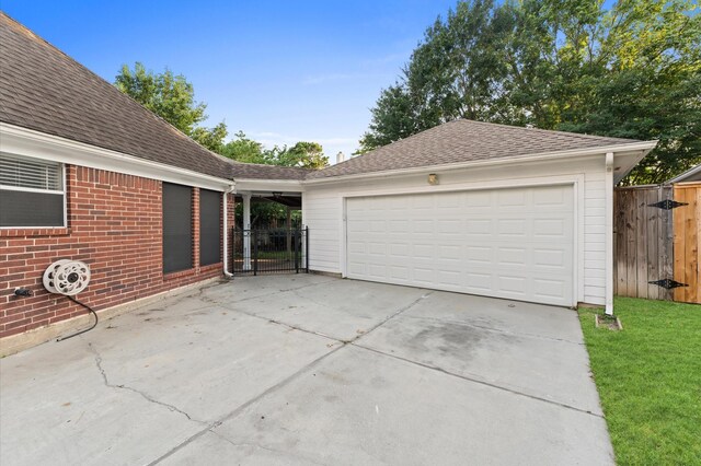 6119 Plantation Bay Dr, Katy, TX 77449 - garage featuring a gate and driveway