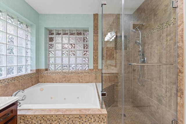 6119 Plantation Bay Dr, Katy, TX 77449 - full bath with a tub with jets, a stall shower, and vanity