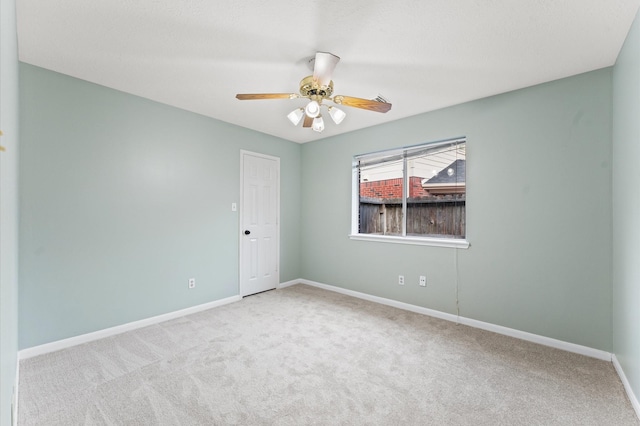 6119 Plantation Bay Dr, Katy, TX 77449 - carpeted spare room with baseboards and a ceiling fan