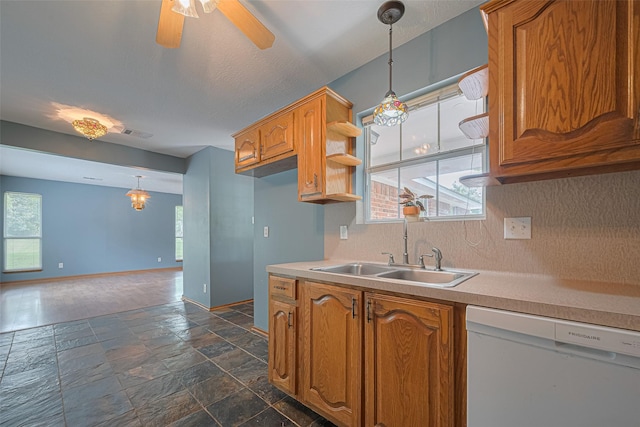 144 Pin Oak Ln, Hempstead, TX 77445 - kitchen with white dishwasher, a sink, stone tile floors, tasteful backsplash, and a ceiling fan