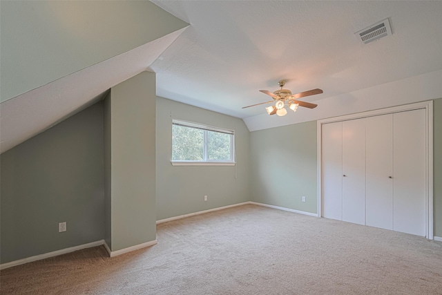 144 Pin Oak Ln, Hempstead, TX 77445 - additional living space with carpet floors, lofted ceiling, ceiling fan, and baseboards