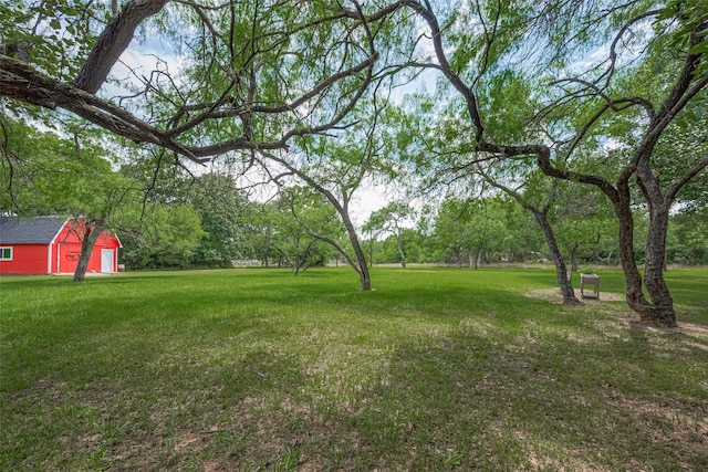 144 Pin Oak Ln, Hempstead, TX 77445 - view of grassy yard featuring an outdoor structure