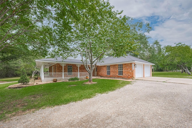 144 Pin Oak Ln, Hempstead, TX 77445 - ranch-style house featuring driveway, a porch, a garage, brick siding, and a front yard