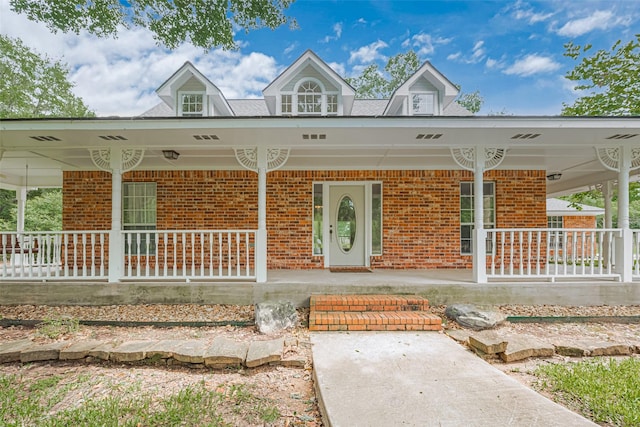 144 Pin Oak Ln, Hempstead, TX 77445 - view of front of home with covered porch and brick siding