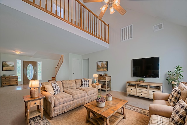 144 Pin Oak Ln, Hempstead, TX 77445 - living area with a towering ceiling, a ceiling fan, stairs, carpet, and baseboards