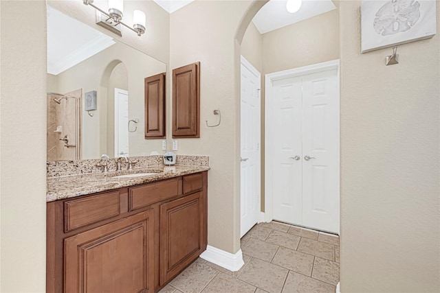 3730 Arundel Gardens Ln, Sugar Land, TX 77498 - full bath featuring vanity, a shower, crown molding, baseboards, and a closet