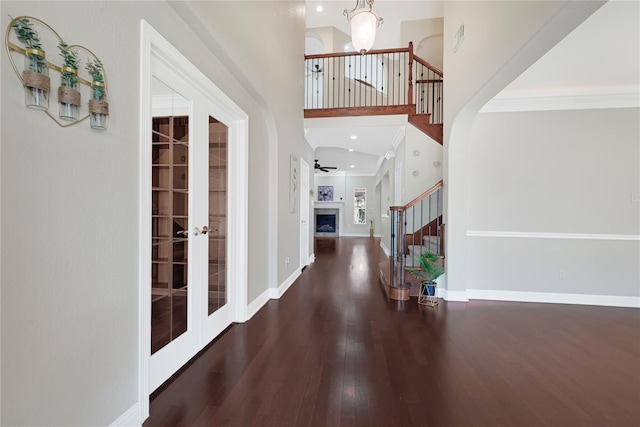 3730 Arundel Gardens Ln, Sugar Land, TX 77498 - entryway with stairway, wood finished floors, french doors, a high ceiling, and crown molding