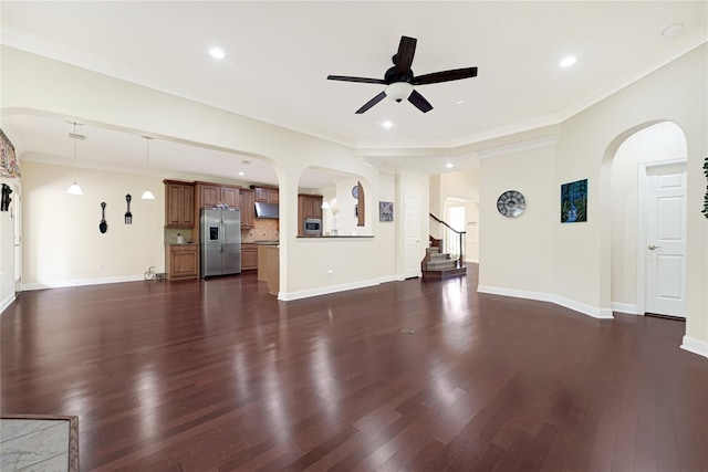 3730 Arundel Gardens Ln, Sugar Land, TX 77498 - unfurnished living room featuring ceiling fan, arched walkways, dark wood-style floors, recessed lighting, and baseboards
