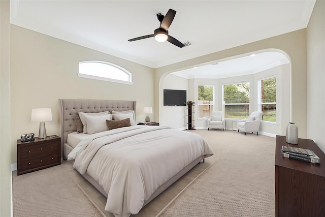 3730 Arundel Gardens Ln, Sugar Land, TX 77498 - bedroom with crown molding, arched walkways, light carpet, a ceiling fan, and baseboards
