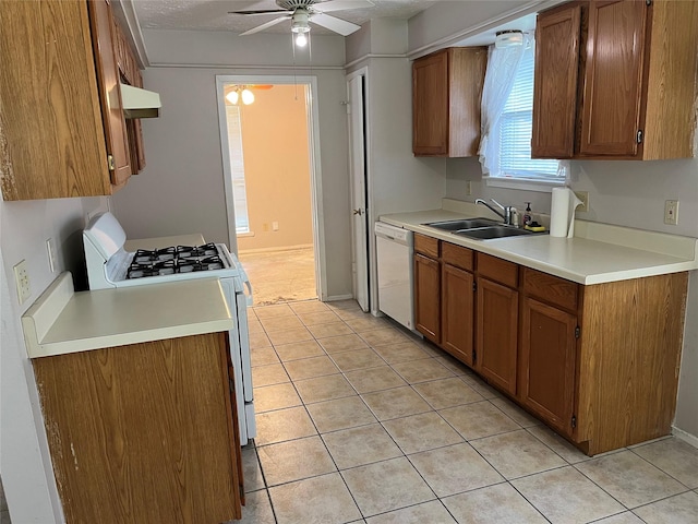 9530 Landry Blvd, Spring, TX 77379 - kitchen with white appliances, a sink, ceiling fan, and brown cabinets