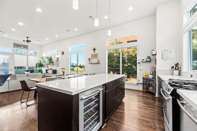 104 Pierce St, Houston, TX 77002 - kitchen with beverage cooler, plenty of natural light, dark wood-style flooring, and recessed lighting