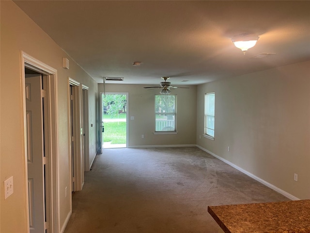 2430 Florence St, La Marque, TX 77568 - spare room with light colored carpet, baseboards, and ceiling fan