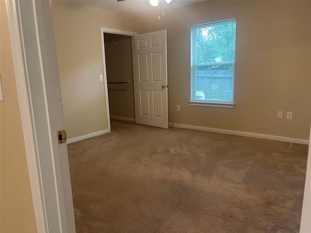 2430 Florence St, La Marque, TX 77568 - empty room with carpet, ceiling fan, and baseboards