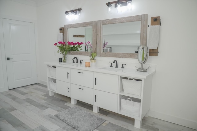 323 E Palm St, Fresno, TX 77545 - full bathroom with double vanity and wood finished floors