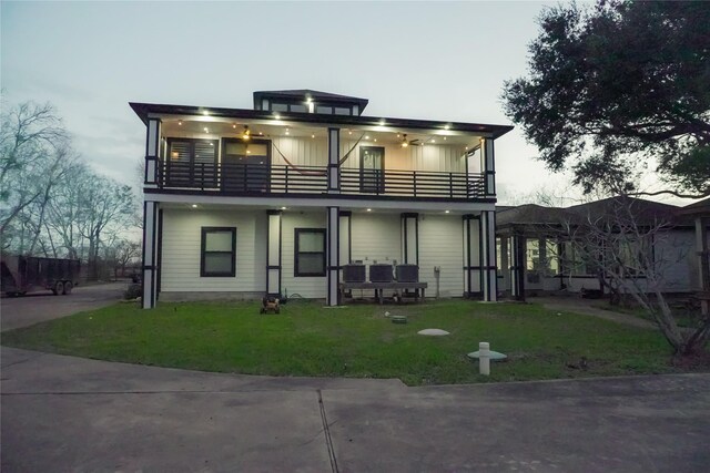 323 E Palm St, Fresno, TX 77545 - view of front of house featuring a balcony and a front yard