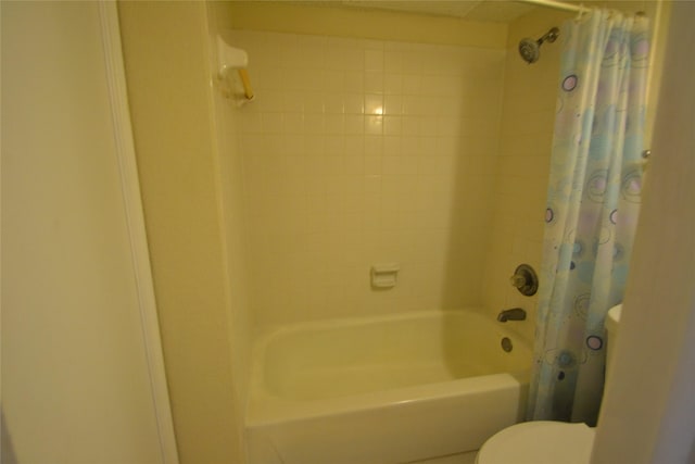 2121 Hepburn Sts Unit 713, Houston, TX 77054 - bathroom with shower / bath combo with shower curtain and toilet