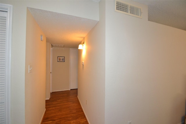 2121 Hepburn Sts Unit 713, Houston, TX 77054 - corridor with a textured ceiling, wood finished floors, and baseboards