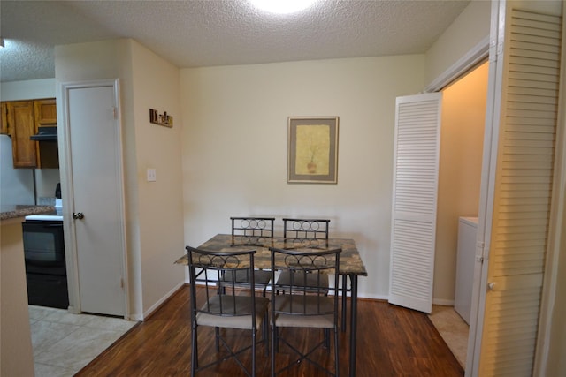 2121 Hepburn Sts Unit 713, Houston, TX 77054 - dining room featuring wood finished floors and a textured ceiling