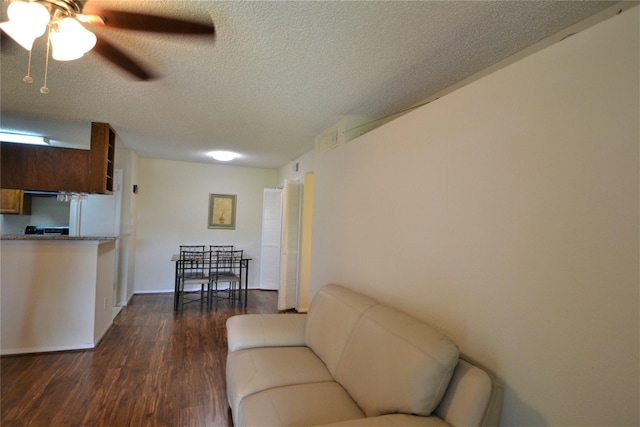 2121 Hepburn Sts Unit 713, Houston, TX 77054 - living room with ceiling fan, dark wood finished floors, and a textured ceiling