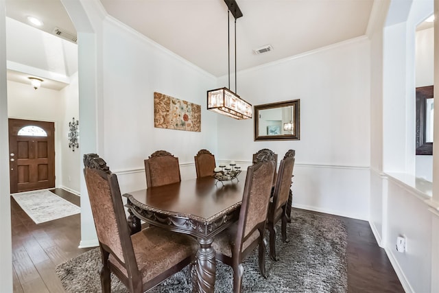 7518 Rain Meadow Ln, Cypress, TX 77433 - dining room with wood finished floors, ornamental molding, baseboards, and a chandelier