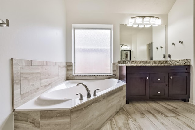 7518 Rain Meadow Ln, Cypress, TX 77433 - bathroom featuring vanity and a garden tub