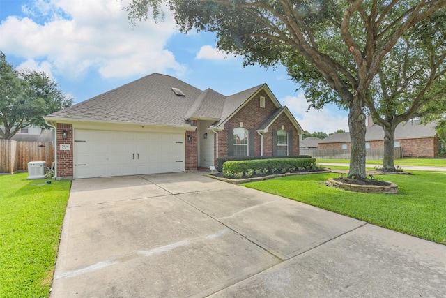 7518 Rain Meadow Ln, Cypress, TX 77433 - traditional home with brick siding, an attached garage, concrete driveway, and a shingled roof