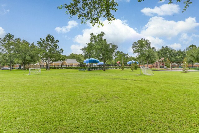 7518 Rain Meadow Ln, Cypress, TX 77433 - view of yard with an area for sports