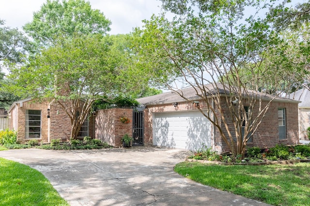 2010 Round Lake Dr, Houston, TX 77077 - view of front of property with concrete driveway, a garage, and brick siding