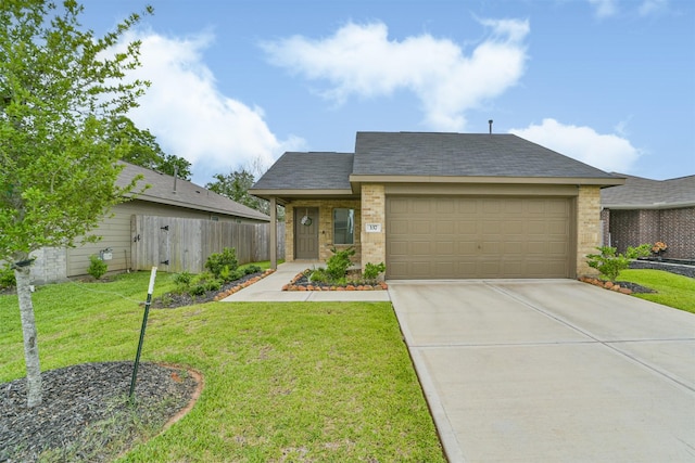 337 Riverwood Village Ln, Sealy, TX 77474 - view of front of home with a garage, driveway, and brick siding