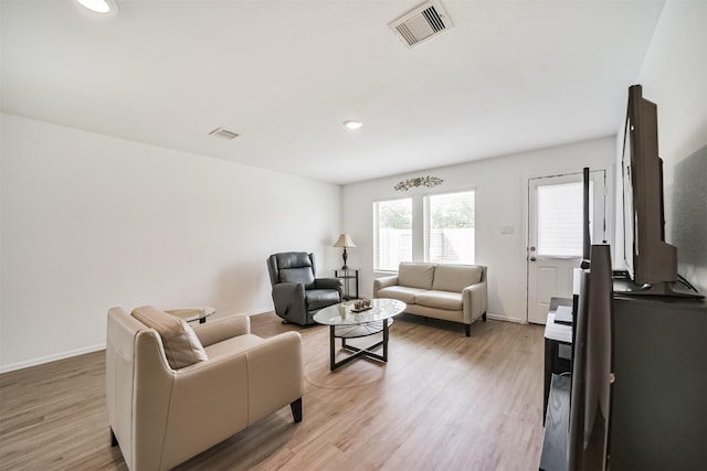 337 Riverwood Village Ln, Sealy, TX 77474 - living room with light wood-style flooring, recessed lighting, and baseboards