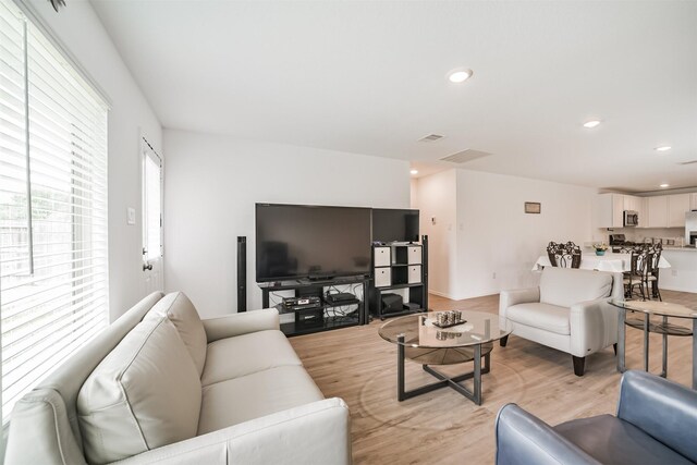 337 Riverwood Village Ln, Sealy, TX 77474 - living area featuring light wood-style flooring and recessed lighting