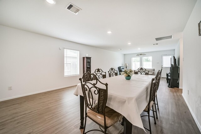 337 Riverwood Village Ln, Sealy, TX 77474 - dining area with wood finished floors, baseboards, and recessed lighting