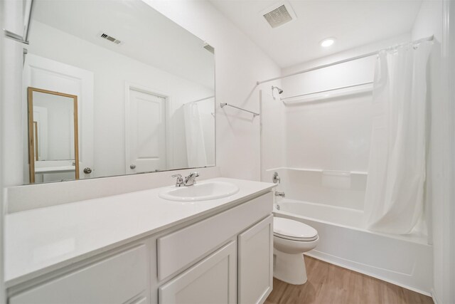 337 Riverwood Village Ln, Sealy, TX 77474 - full bath with toilet, shower / bath combination with curtain, vanity, and wood finished floors