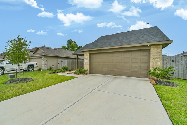 337 Riverwood Village Ln, Sealy, TX 77474 - view of front of home featuring brick siding, concrete driveway, and an attached garage