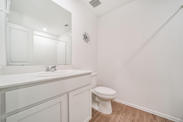 337 Riverwood Village Ln, Sealy, TX 77474 - full bath featuring toilet, wood finished floors, vanity, baseboards, and a shower