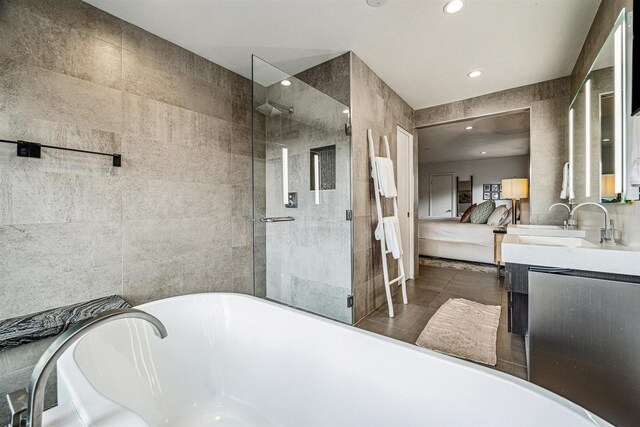 5231 Lamonte Ln, Houston, TX 77092 - full bathroom featuring a soaking tub, a stall shower, vanity, and recessed lighting