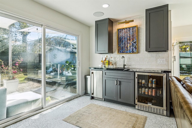 5231 Lamonte Ln, Houston, TX 77092 - indoor wet bar with wine cooler, plenty of natural light, refrigerator, and recessed lighting