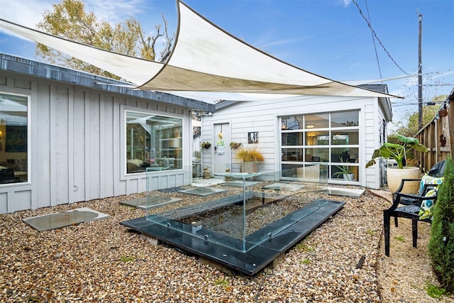 5231 Lamonte Ln, Houston, TX 77092 - back of property with board and batten siding and a vegetable garden