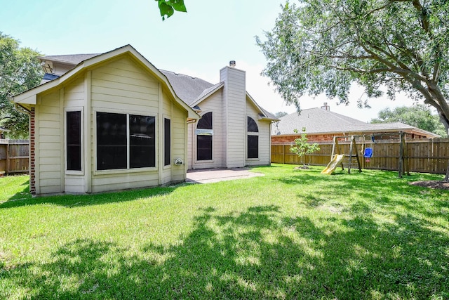 3550 Beacons Vw, Friendswood, TX 77546 - rear view of property with a playground and a patio area