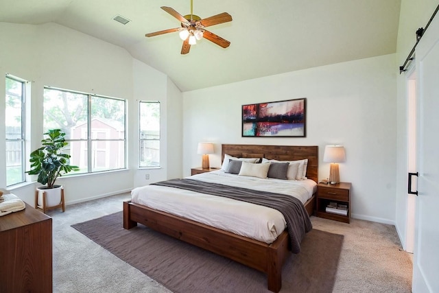 3550 Beacons Vw, Friendswood, TX 77546 - bedroom featuring light carpet, vaulted ceiling, a barn door, and baseboards