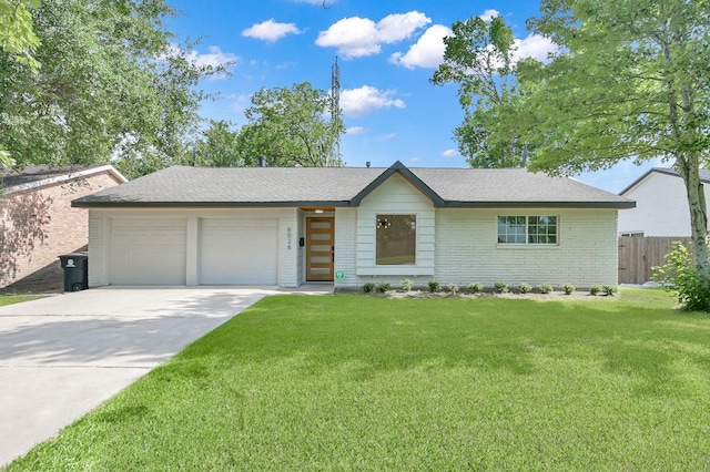 6026 Willowbend Blvd, Houston, TX 77096 - view of front of property featuring an attached garage, concrete driveway, brick siding, and a shingled roof