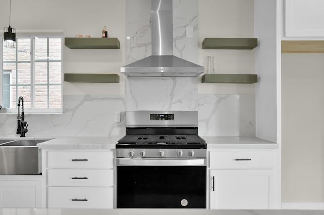 6026 Willowbend Blvd, Houston, TX 77096 - kitchen with open shelves, wall chimney range hood, gas stove, a sink, and backsplash