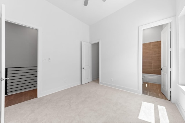 4710 Gunter St, Houston, TX 77020 - unfurnished bedroom with carpet flooring, baseboards, connected bathroom, and ceiling fan