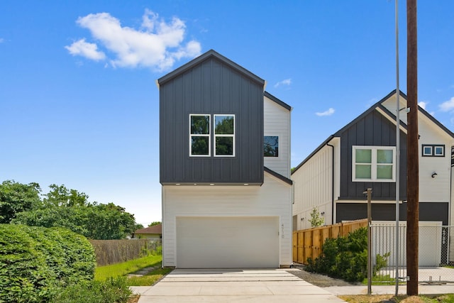 4710 Gunter St, Houston, TX 77020 - contemporary home with board and batten siding, driveway, and a garage