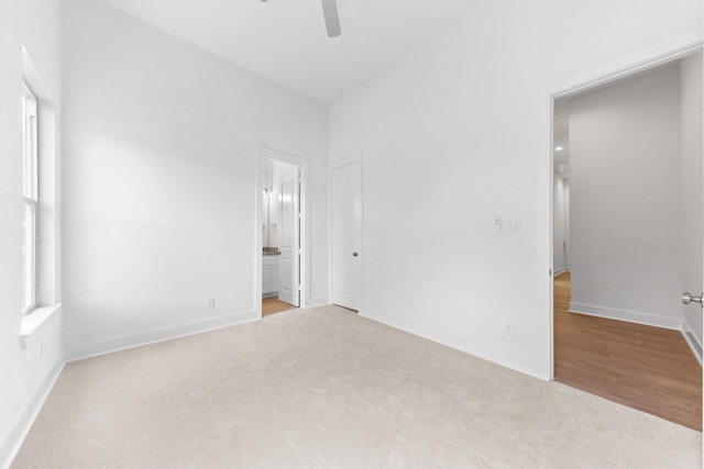 4710 Gunter St, Houston, TX 77020 - unfurnished bedroom featuring carpet floors, baseboards, ensuite bathroom, and ceiling fan