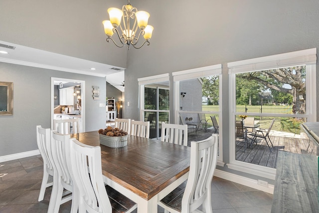 20107 Sunny Shores Dr, Humble, TX 77346 - dining area featuring baseboards, a chandelier, ornamental molding, and a towering ceiling